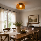 Green ceiling light above a warm wood dining area.