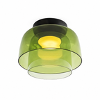 Green double-layer compact ceiling light on white.