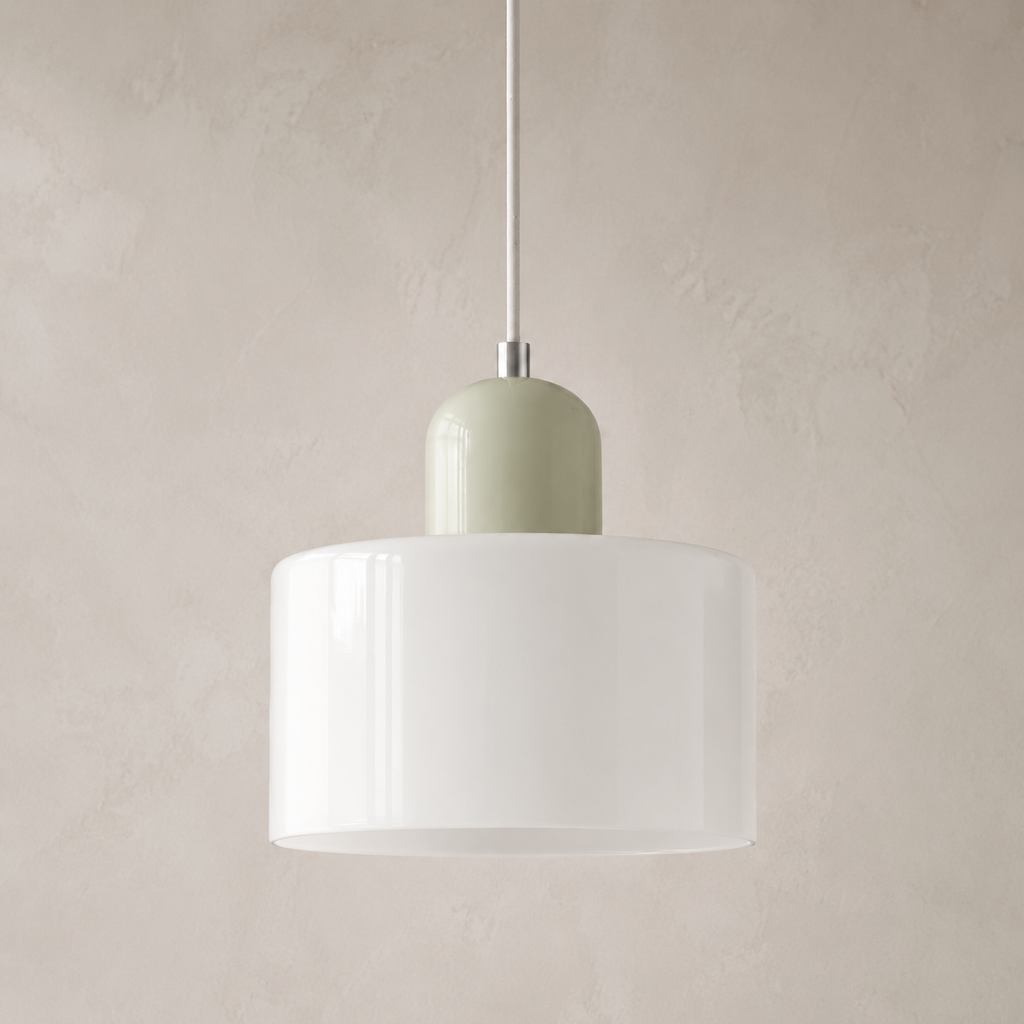 Close view of a white circular glass pendant light with a pale sage cap