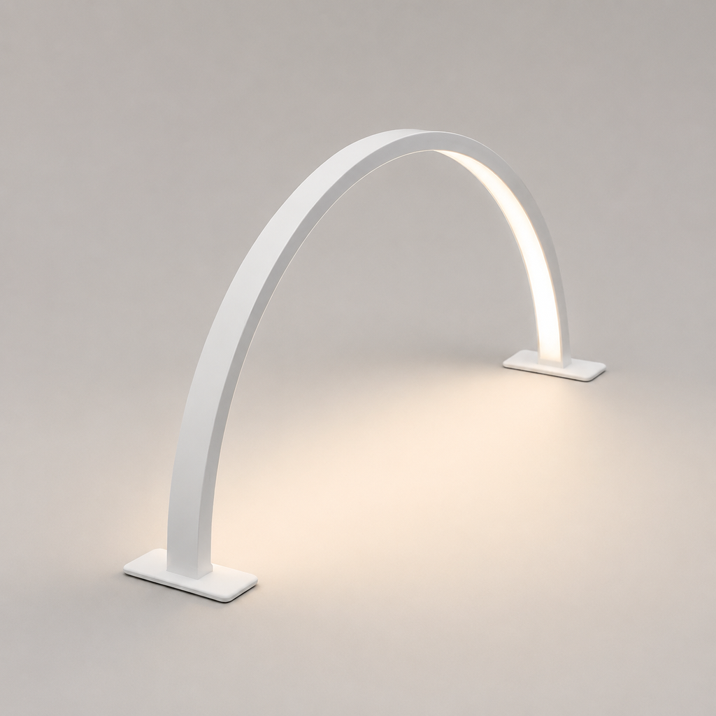 White crescent moon LED desk lamp isolated on a warm grey studio background.