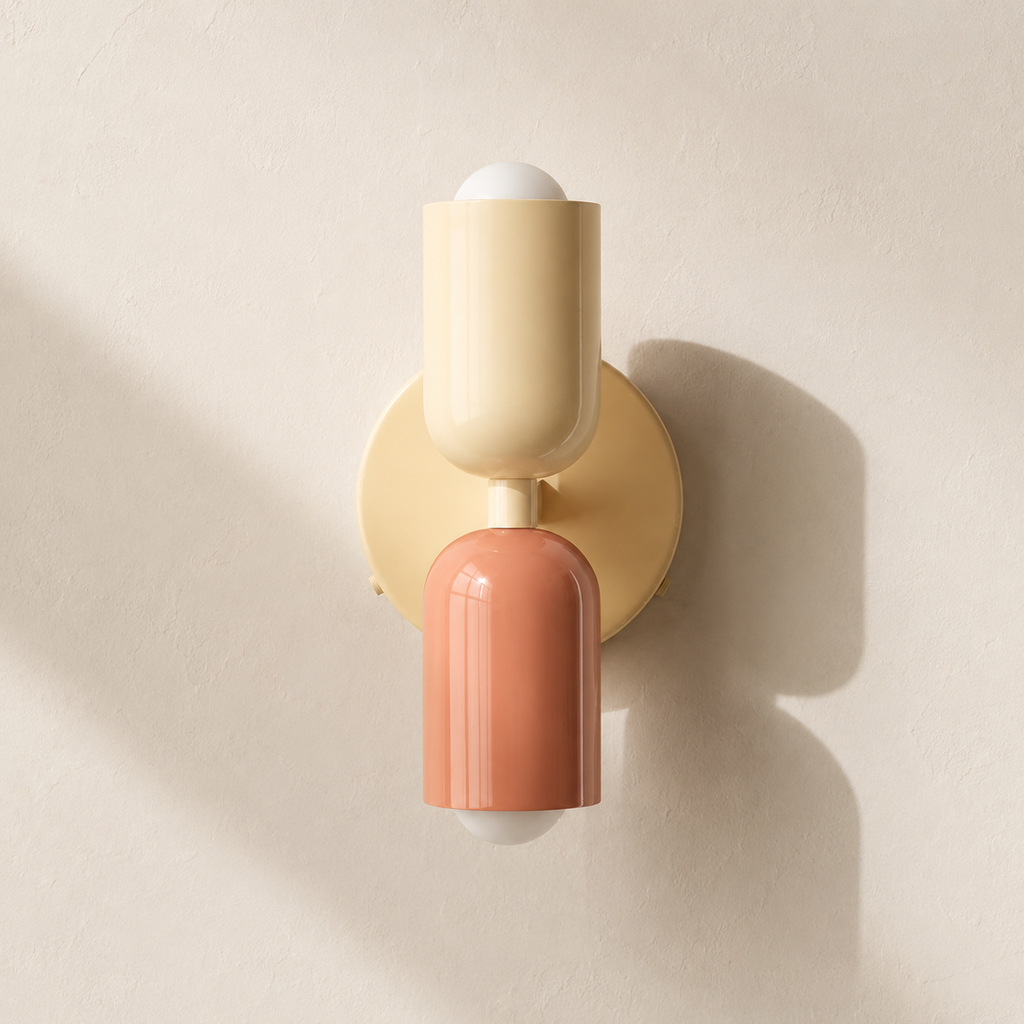 Beige and pink double Scandinavian wall sconce on a warm ivory wall