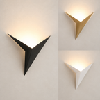 Black gold and white geometric star LED wall sconces glowing in a comparison view