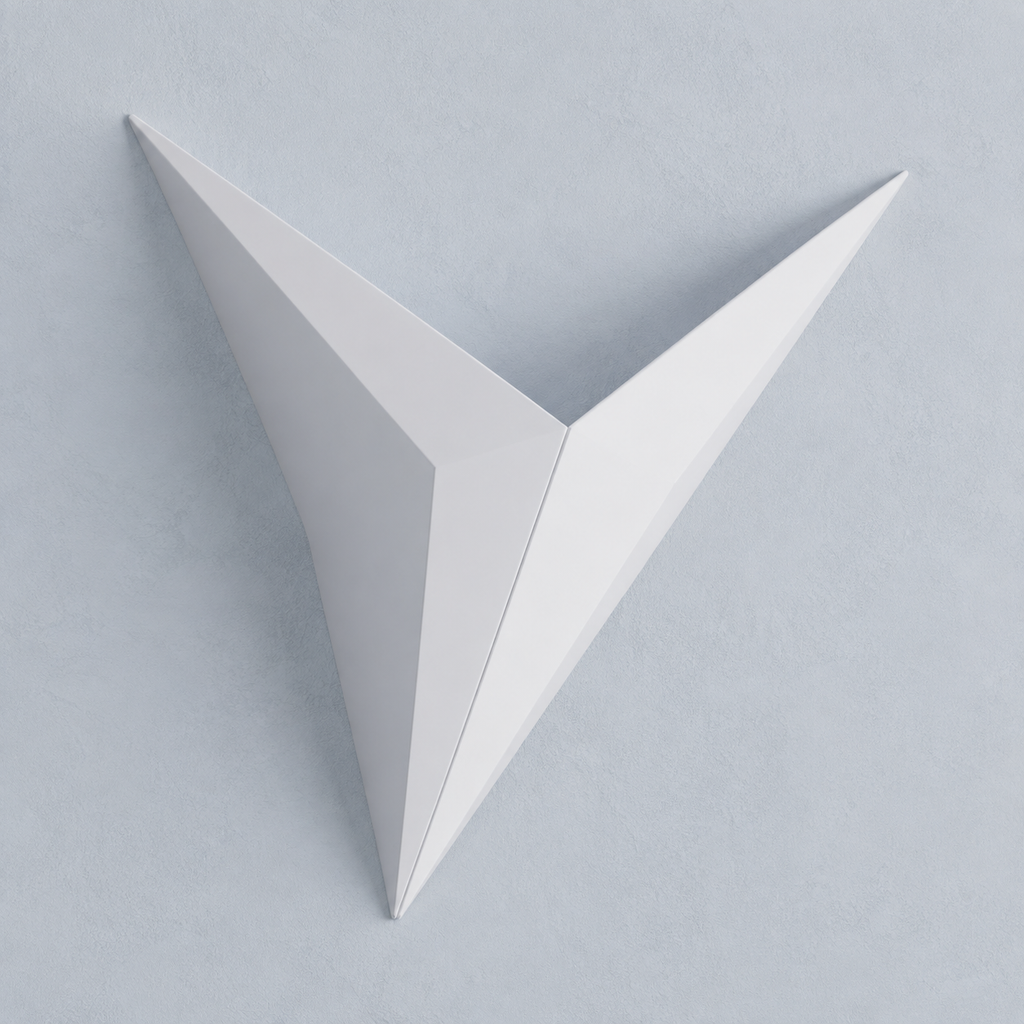 White geometric star LED wall sconce on a pale blue-gray wall