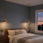 Two terracotta hand-painted ceramic pendant lights glowing above a bedroom bed