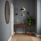 Two blue-green hand-painted ceramic pendant lights glowing in an American entry