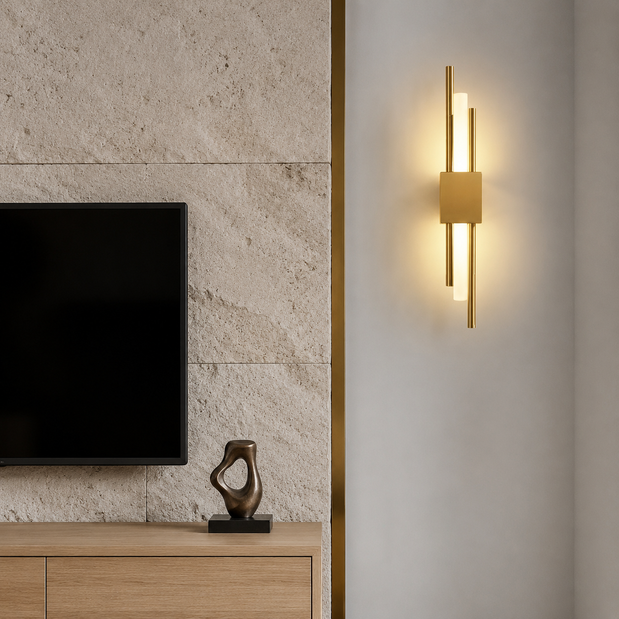 Gold dual-rod LED wall sconce beside a textured limestone media wall