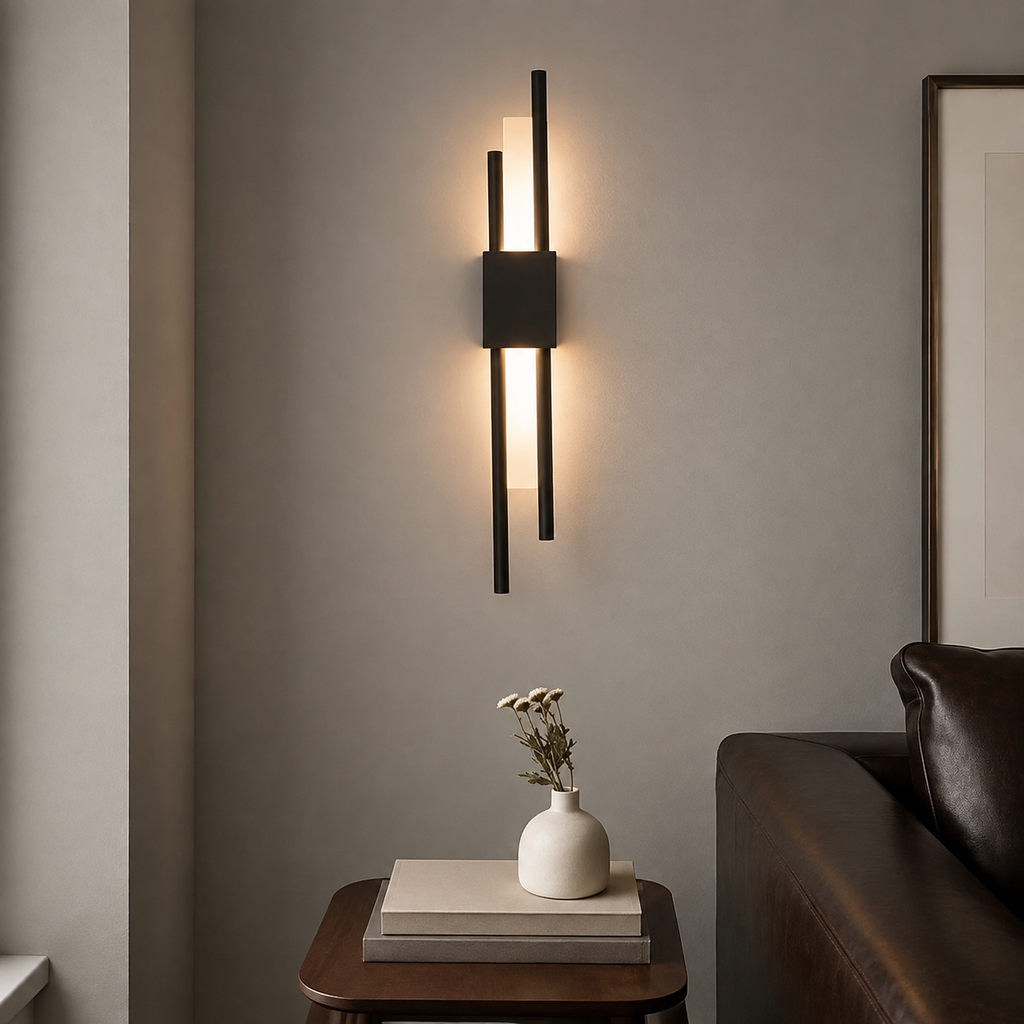 Black dual-rod LED wall sconce illuminating a leather reading corner