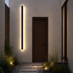 Black linear outdoor wall light beside a walnut courtyard door