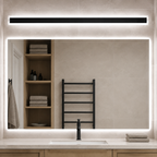 Horizontal black linear LED wall light above a modern bathroom mirror