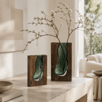 Small and tall live edge wood vases with smoky green glass and flowering branches