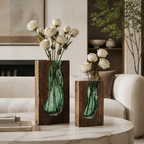 Pair of Nordic wood and green glass vases with cream roses on a coffee table