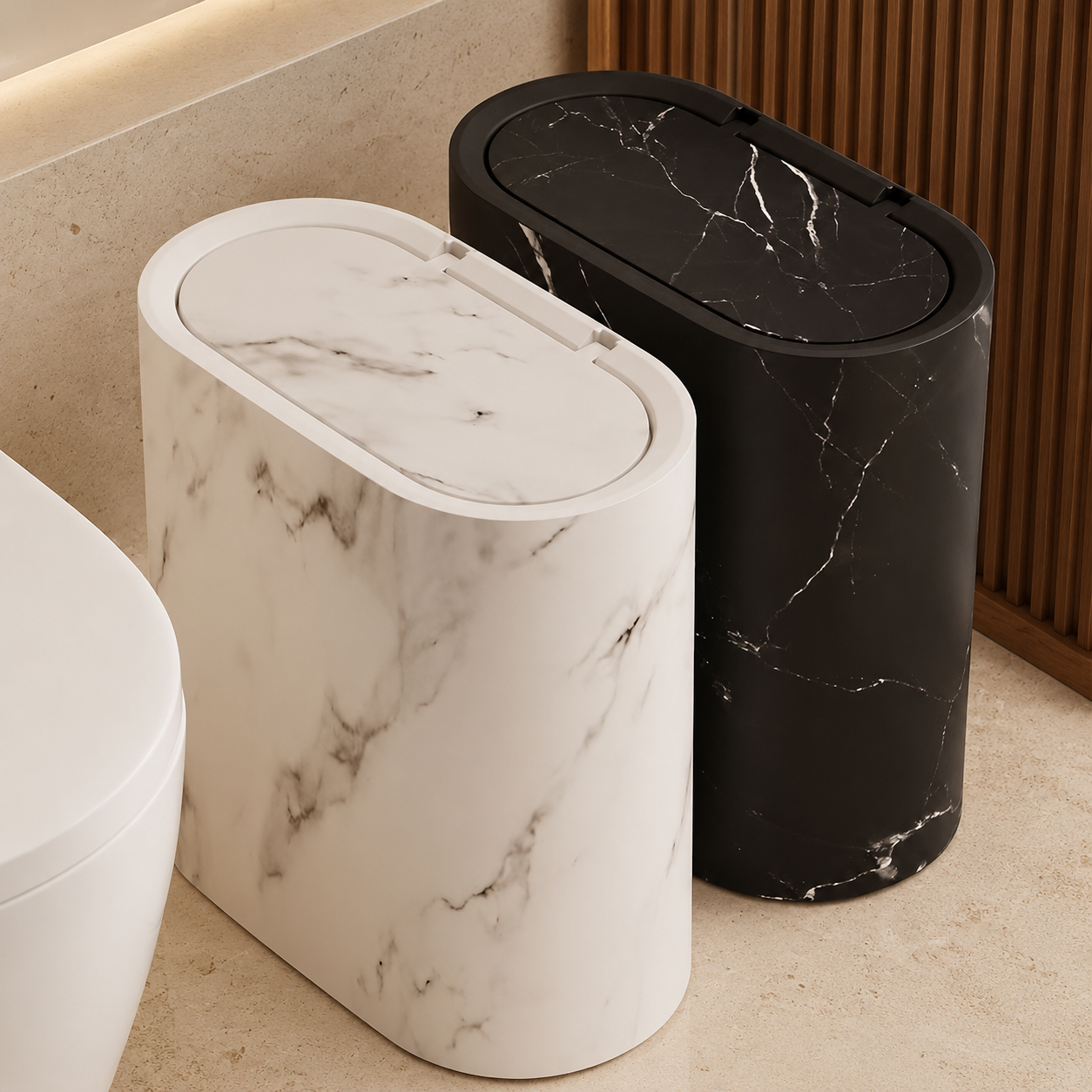 Cream and black marble oval trash cans arranged together in a bathroom