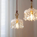 Pendant Light with a decorative floral crystal shade in a clear and gold finish