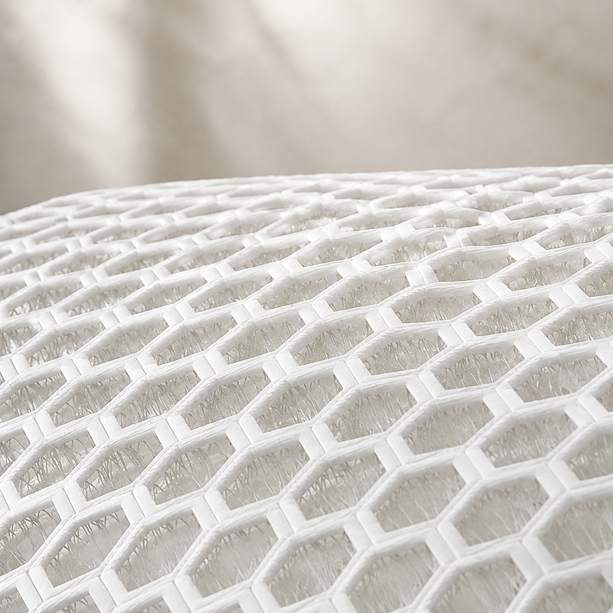 Pregnancy pillow fabric shown in a close macro view with raised breathable mesh texture