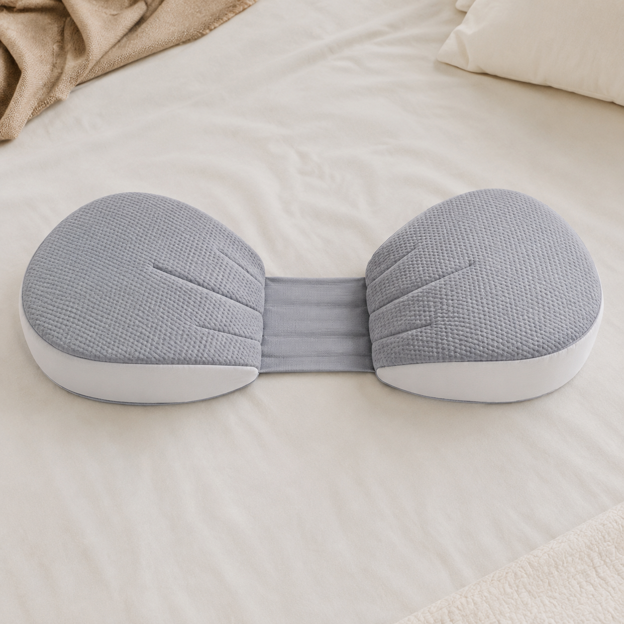 Gray pregnancy pillow shown flat with two cushions joined by an adjustable center panel