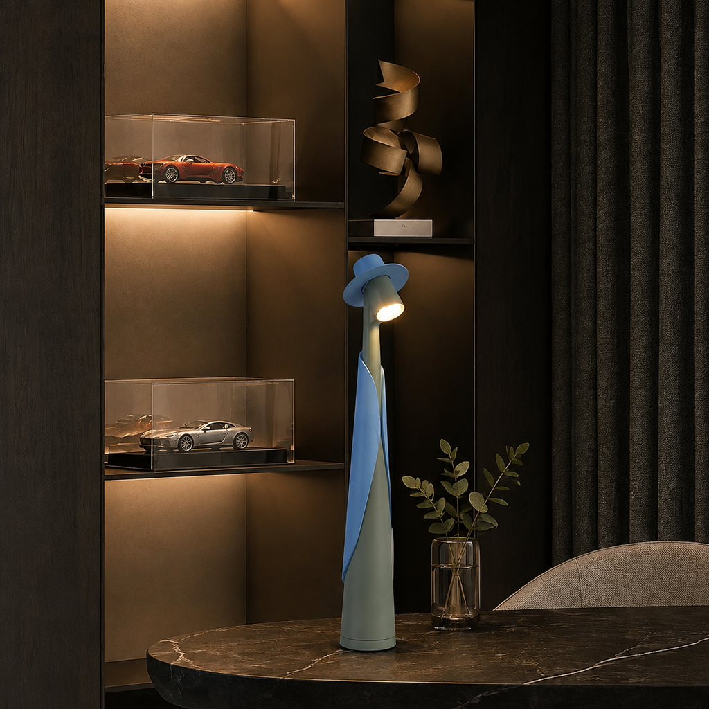 Blue and green rechargeable LED hat lamp displayed on a dark console table.