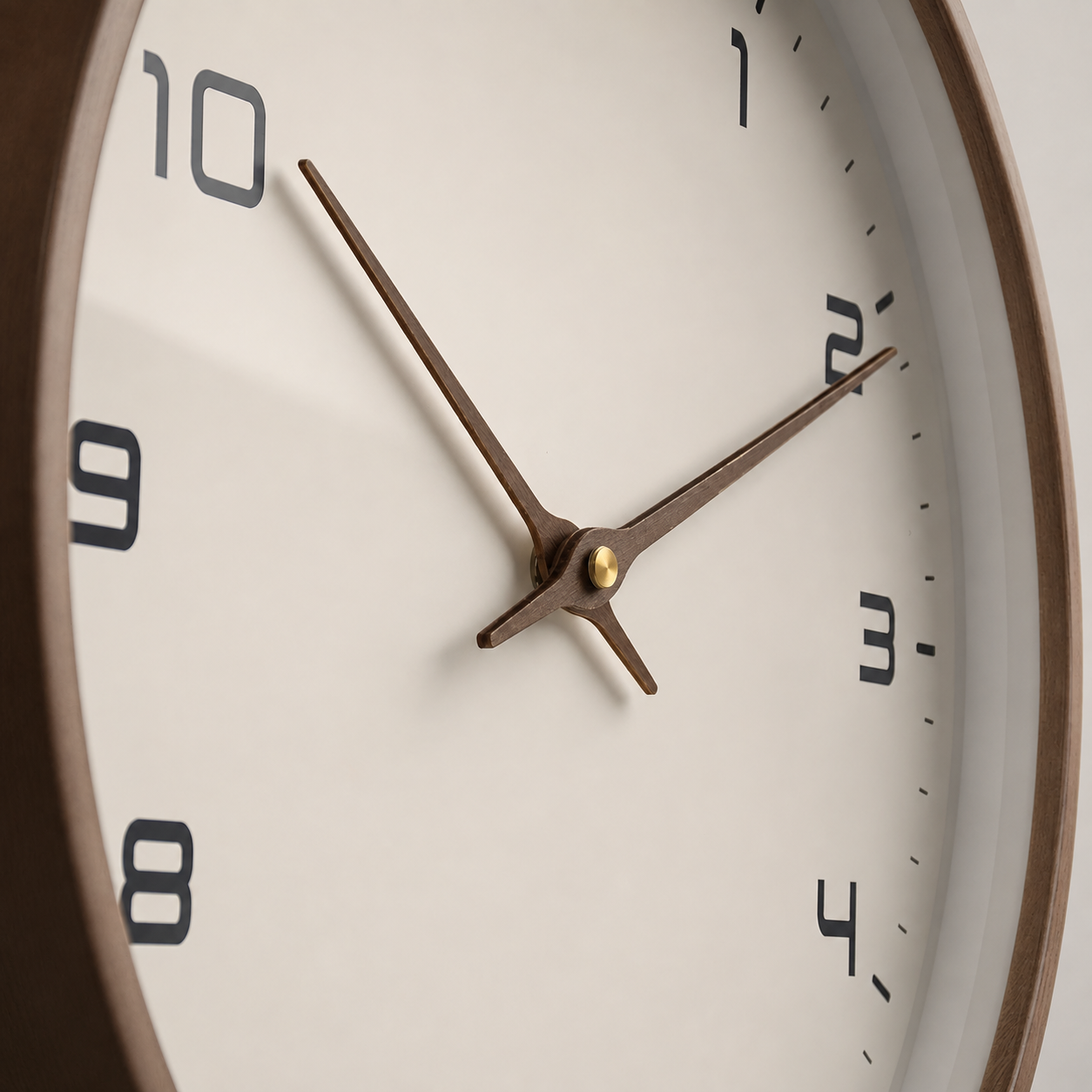 Close view of the wall clock dial, wood frame and brass brown hands