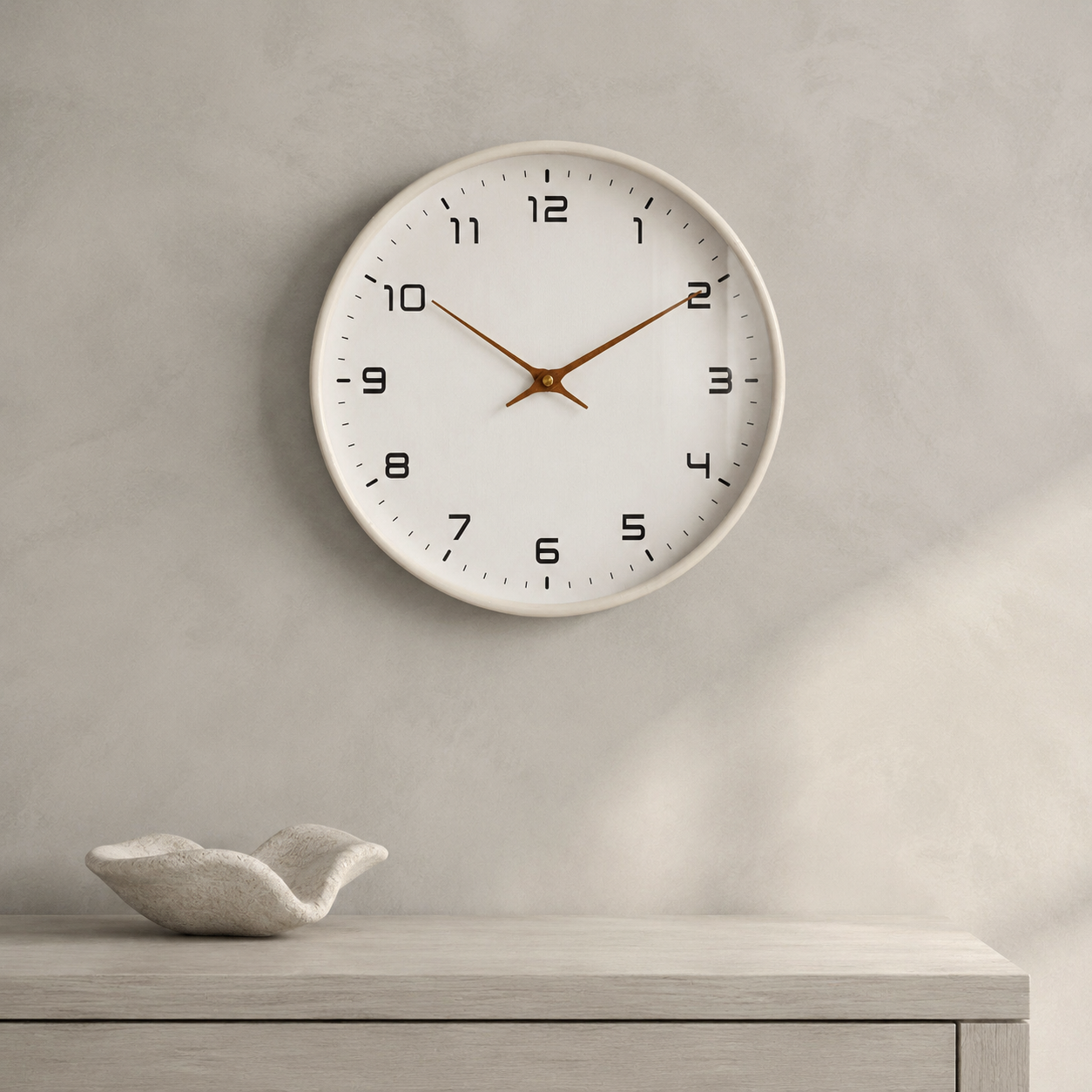 Cream frame silent quartz wall clock in a minimalist interior