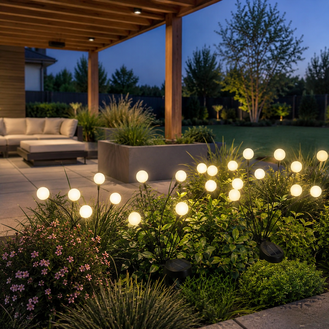 Solar garden lights illuminating a landscaped American backyard patio