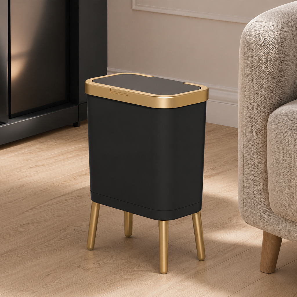 Black trash can with elevated gold legs beside a sofa in a contemporary living room.