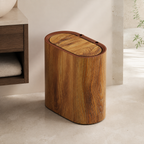 Wood grain oval trash can in a warm contemporary bathroom