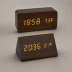 Brown block and triangular LED alarm clocks shown together