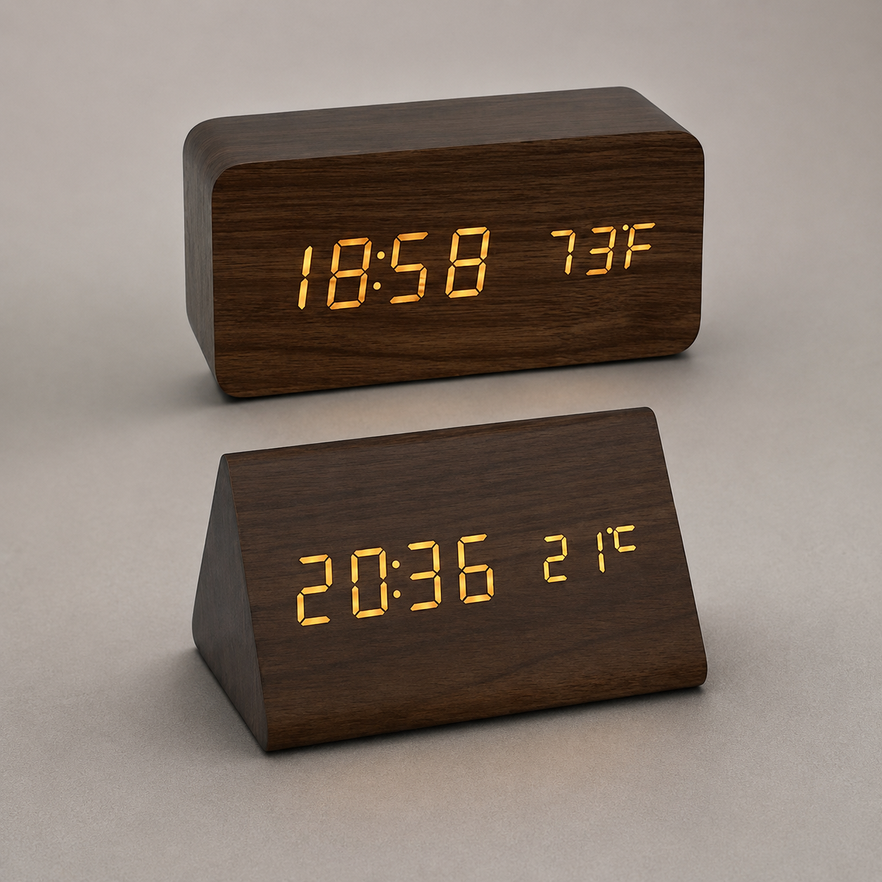 Brown block and triangular LED alarm clocks shown together